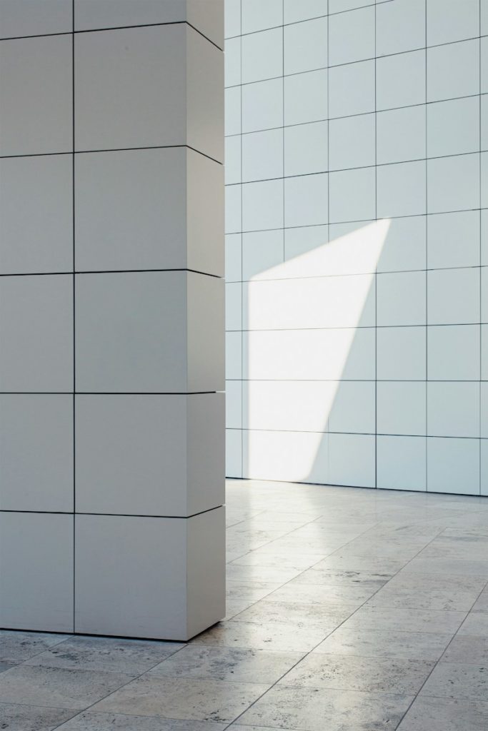 a white wall with a shadow on it